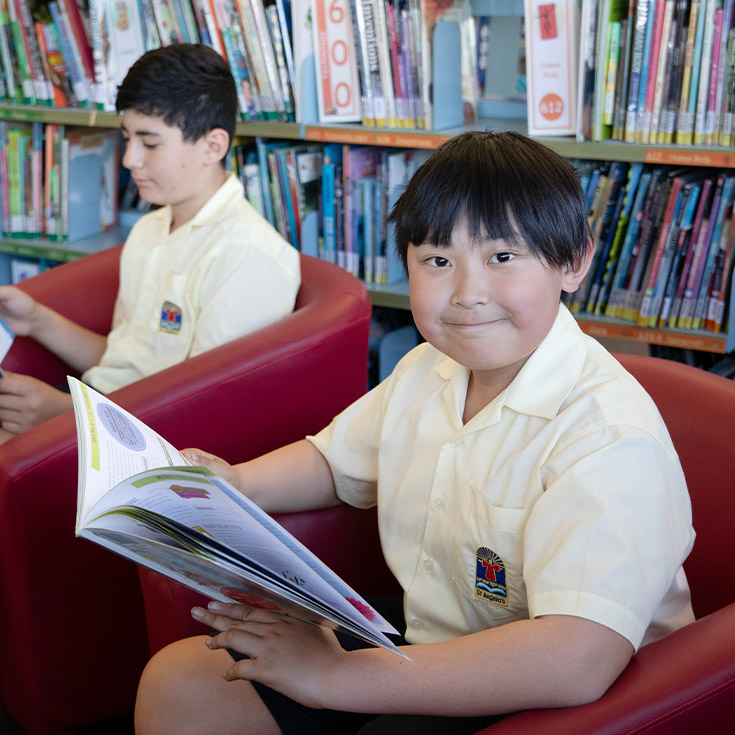 Students reading in the library at St Angela's Primary School Castle Hill