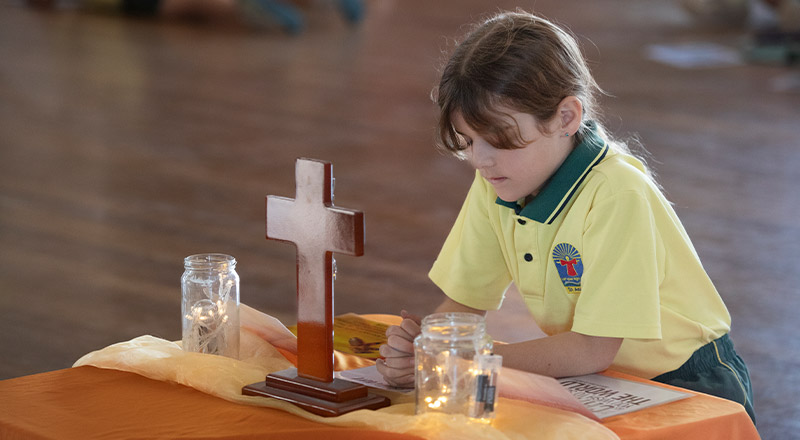 Student reflecting in the prayer space in the classroom at St Angela's Primary School Castle Hill