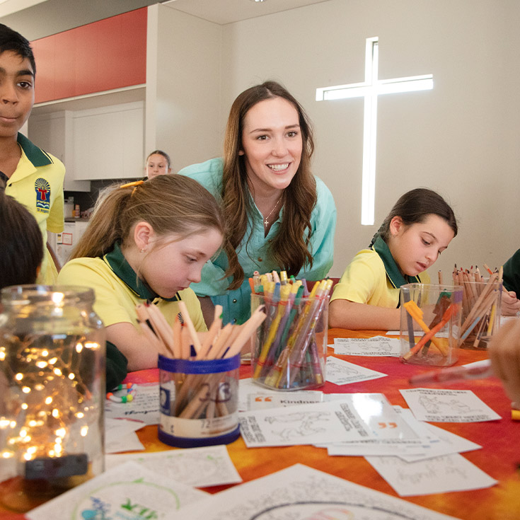 Teacher with her students in the classroom at St Angela's Primary School Castle Hill